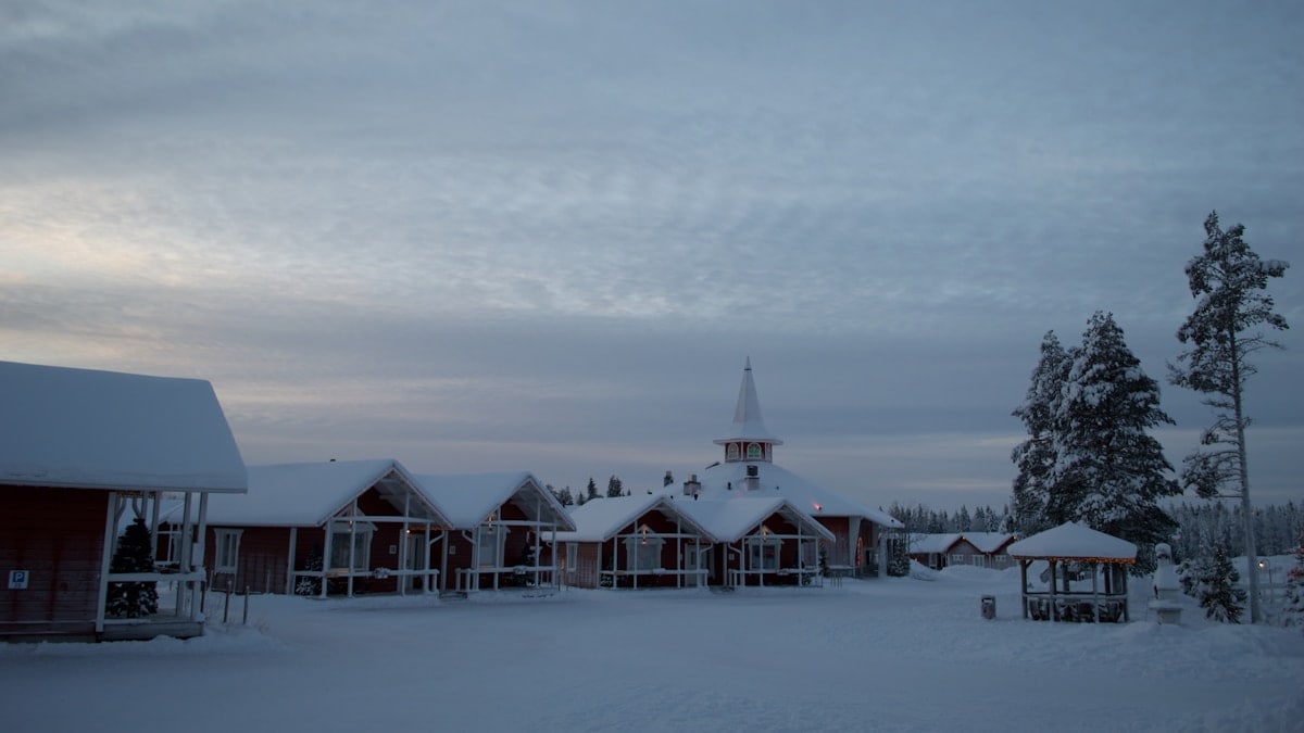 a small church in the middle of a snowy field